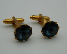 A pair of cufflinks.