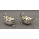 A pair of silver sauce boats. 16 cm long. 11.