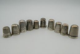 A quantity of silver thimbles