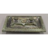 A 19th century Empire bronze inkstand. 32 cm wide.