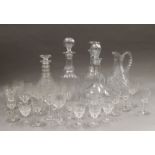 A quantity of cut glass decanters and glass