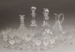 A quantity of cut glass decanters and glass