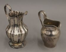 Two silver cream jugs. The largest 12 cm high. 6.3 troy ounces.