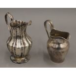 Two silver cream jugs. The largest 12 cm high. 6.3 troy ounces.