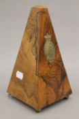 A Victorian walnut metronome.