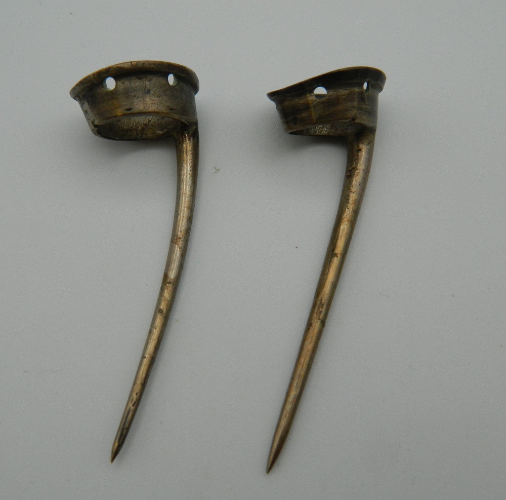 A pair of cock fighting spurs. 5.5 cm long.