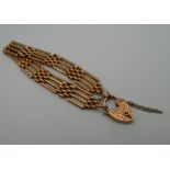 A 9 ct gold gate bracelet, with padlock clasp. 16 cm long. 15.9 grammes.