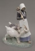 A Copenhagen porcelain model of a goat herdess. 22 cm high.