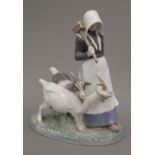 A Copenhagen porcelain model of a goat herdess. 22 cm high.