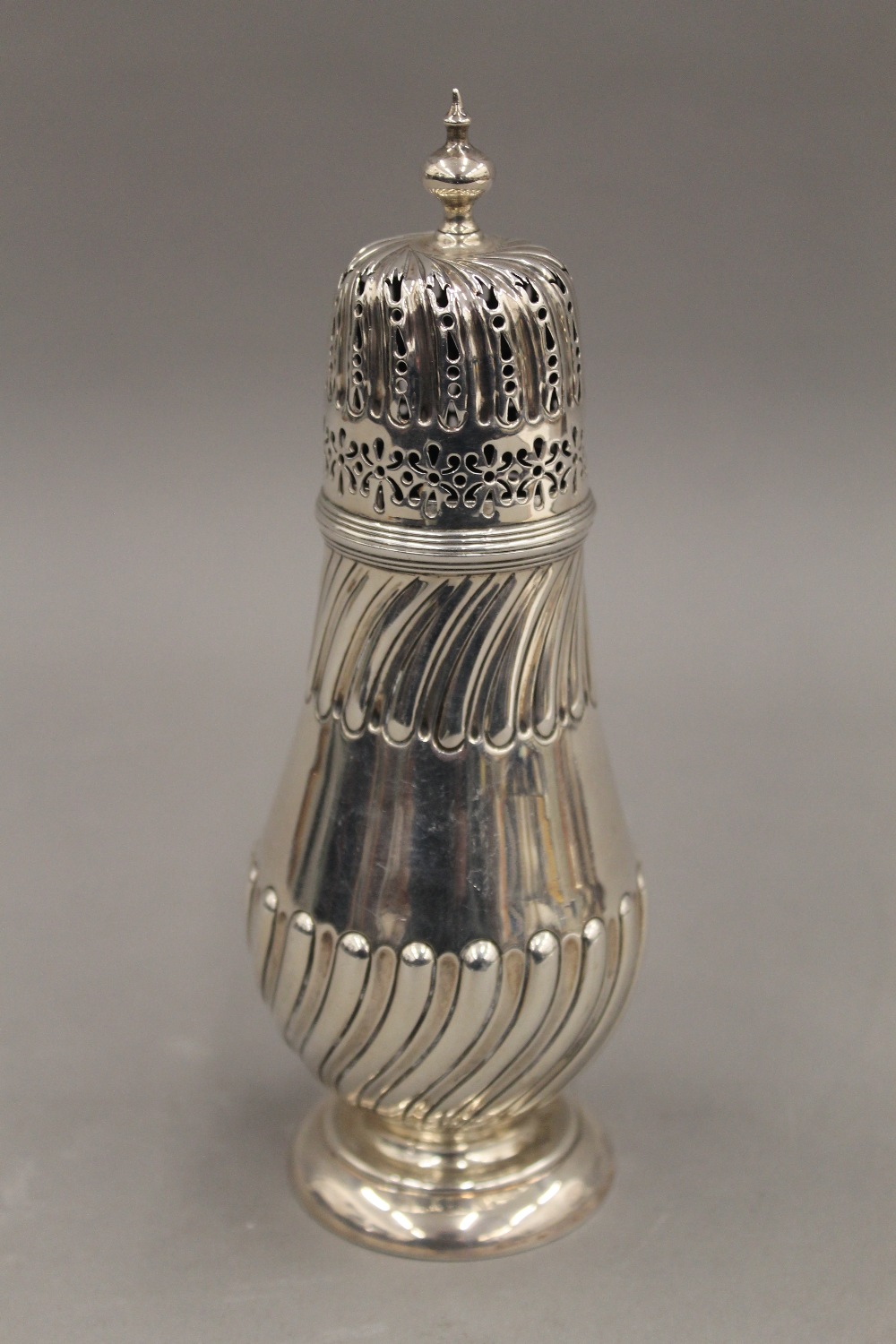 A silver sugar caster. 17.5 cm high. 5.2 troy ounces.