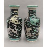 A pair of Chinese famille noir vases. 44 cm high.
