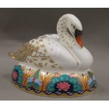 A Royal Crown Derby swan paperweight, with stopper. 13 cm long.