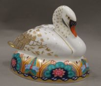 A Royal Crown Derby swan paperweight, with stopper. 13 cm long.
