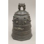 A 19th century Tibetan bronze temple bell. 19 cm high.