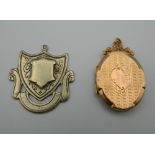 A 9 ct gold front and back locket and a Durban silver fob. The former 3.5 cm high.