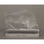 A Lalique glass model of a bull, inscribed LALIQUE FRANCE. 11 cm wide.