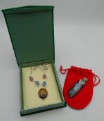 A stone set silver necklace and a mineral form pendant. The pendant 7 cm high.