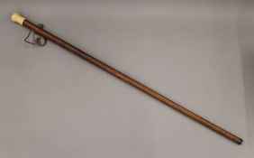 An early 19th century ivory handled walking stick. 85.5 cm long.
