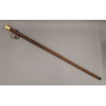 An early 19th century ivory handled walking stick. 85.5 cm long.