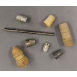 A quantity of various silver and other thimbles, thimble cases, etc.