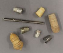 A quantity of various silver and other thimbles, thimble cases, etc.