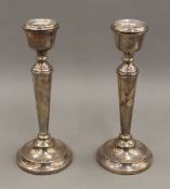 A pair of silver candlesticks. 20.5 cm high. 17.3 troy ounces loaded.