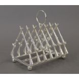 A silver plated rifle toast rack. 11 cm long.