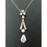 An unmarked white gold or platinum diamond set drop pendant on chain. The drop approximately 0.