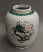 A Chinese porcelain vase decorated with dragons. 27 cm high.