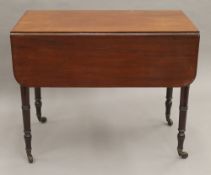 A Victorian mahogany Pembroke table. 50 cm wide flaps down.