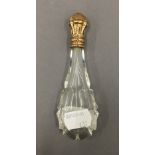 A Continental gold topped glass scent bottle. 12.5 cm high.