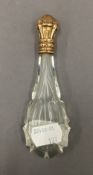 A Continental gold topped glass scent bottle. 12.5 cm high.