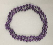 A string of amethyst beads. 72 cm long.