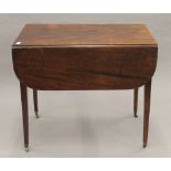 A 19th century mahogany Pembroke table. 82 cm long.