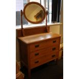 An Arts and Crafts oak mirrored dressing table. 91 cm wide, 149 cm high, 45.5 cm deep.