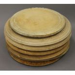 A collection of bread boards and a bread knife. The largest 30 cm diameter.