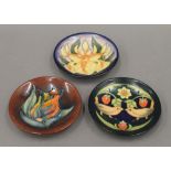 Three small modern Moorcroft dishes. Each approximately 11.5 cm diameter.