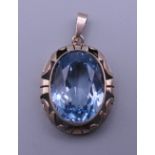 A 14 ct gold blue stone, possibly aquamarine pendant. 3 cm high. 9.4 grammes total weight.