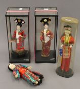 Four various Chinese dolls. The largest 28 cm high.