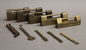 A collection of brass Chinese cabinet locks and keys. The largest 9 cm long.