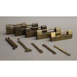 A collection of brass Chinese cabinet locks and keys. The largest 9 cm long.