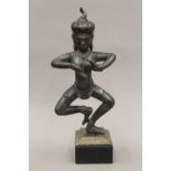 An antique Indian patinated bronze deity, on stand. 36.5 cm high.