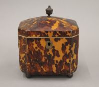 A 19th century tortoiseshell tea caddy. 10.5 cm high.