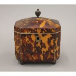 A 19th century tortoiseshell tea caddy. 10.5 cm high.