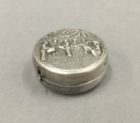 A Chinese unmarked silver tape measure. 4 cm diameter.