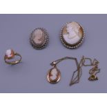 Two cameo brooches, a pendant and a ring. The largest 3.5 cm high.