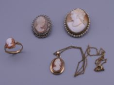 Two cameo brooches, a pendant and a ring. The largest 3.5 cm high.