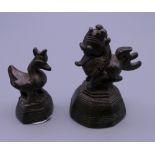 Two Burmese cast bronze chicken form opium weights. The largest 5.5 cm high.