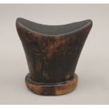 A wooden tribal headrest. 15 cm high.