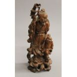 A late 19th/early 20th century Japanese carved wooden figural group. 31 cm high.
